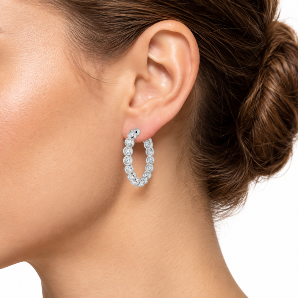 Bezel-set diamond hoop worn on ear — illustrative lifestyle close-up